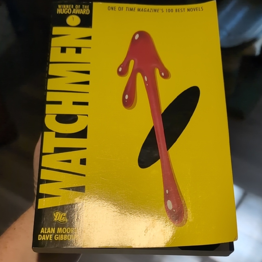 Watchmen Graphic Novel with Yellow and Red Text